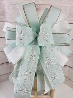 a white bow with snowflakes on it