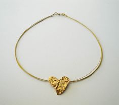 Handmade Gold Heart Pendant Necklace, Gold Double Heart Metal Necklace, Gold Heart Charm Necklace In Brass, Bronze Brass Heart Pendant Jewelry, Yellow Gold Heart-shaped Brass Necklace, Heart-shaped Brass Necklace With Adjustable Chain, Bronze Heart-shaped Brass Necklace, Antique Bronze Heart-shaped Necklace, 24kt Gold