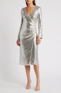 Silvery sequins lend a liquid-shine illusion to this dress designed in a fitted faux-wrap silhouette. Surplice V-neck Long sleeves Lined 95% polyester, 5% spandex Hand wash, line dry Imported V Neck Cocktail Dress, Fall Wardrobe Essentials, Wrap Midi Dress, Midi Cocktail Dress, Romantic Dress, Made Clothing, Silver Dress, Black Cocktail Dress, Faux Wrap Dress