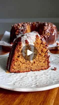 a bundt cake with icing on a white plate