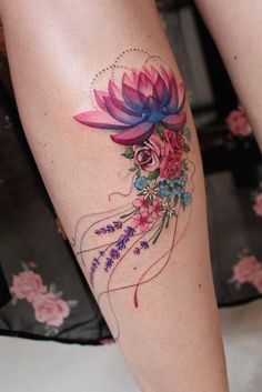 a woman's leg with a flower tattoo on it