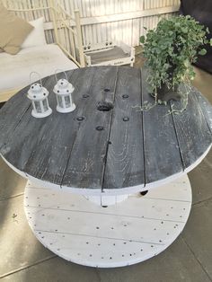 a table made out of an old piece of wood and some plants on top of it