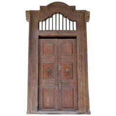 an old wooden door with iron bars on the top and bottom, against a white background