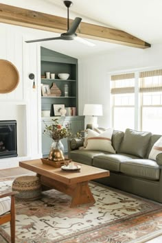 a living room filled with furniture and a fire place