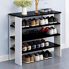 there is a shoe rack with many pairs of shoes on it