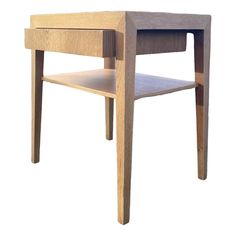 a small wooden table with one drawer open