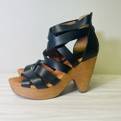 Elevate Your Style With These Stunning Lucky Brand Platform Heels In Black Leather. Perfect For Any Occasion, These Sandals Feature A Zip Closure And A Platform Heel Style That Adds Height And Sophistication To Your Outfit. The Vachetta Leather Upper Material And Leather Outsole Material Ensure Durability And Comfort For Long Wear. This Nib (New In Box) Pair Is A Size 8m/38, Fitting Uk Size 5.5 And Us Size 8.5. The Heels Measure High At 3-3.9 Inches, Making It Ideal For Parties And Cocktail Even Black Sandals With Wooden Heel And Medium Width, Casual Black Heels With Wooden Heel, Wedge Sandals With Wooden Heel And Medium Width, Medium Width Wedge Sandals With Wooden Heel, Black Wedge Sandals With Wooden Heel For Spring, Black Wedge Sandals With Reinforced Heel, Black Wedge Sandals With Wooden Heel And Ankle Strap, Leather Platform Sandals With Single Toe Strap, Black Ankle Strap Heels With Wooden Heel