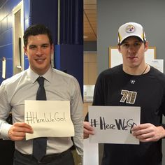 two men holding up signs in front of them, one man is wearing a hat and the other has a tie