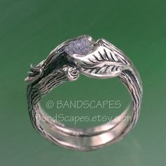 Branch and leaves combine to create a very unique setting. On one side is a graceful polished leaf that wraps the stone. On the other side is a twig, also clasping the stone. Because of this setting style, the stone is more visible and open, yet extremely secure. There is a naturalness to these rings. The stone is a raw diamond. Natural and uncut. Its a little cubic in shape, and the stone color is a bright silver. It weighs .82ct. These rings are finished as-is, and you can purchase this set. B Nature-inspired Jewelry With Single Cut Diamonds For Anniversary, Nature-inspired Untreated Rings For Wedding, Nature-inspired Untreated Wedding Rings, Nature-inspired Jewelry With Single Cut Diamonds As Gift, Nature-inspired Jewelry With Single Cut Diamonds For Gifts, Rustic Silver Jewelry For Wedding, Rustic Handmade Wedding Jewelry, Sterling Silver Wedding Rings, Etsy Wedding Rings