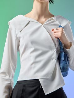 Soft and structured, this slim fitting shirt features unique off-shoulder collars and wrap style front design. Pair yours with various items for trendy and feminine style. - Lightweight nylon fabric- Natural, crisp texture- Fitted design for feminine feel- Asymmetrical hem silhouette- Mini inner snap button at chest Modern Blouse With Lapel Collar For Office, Solid Color Tops With Lapel Collar For Office Wear, Chic Blouse With Lapel Collar, Fitted Asymmetrical Blouse For Formal Occasions, Chic Asymmetrical Shirt For Office, Formal Fitted Asymmetrical Blouse, Chic Asymmetrical Office Shirt, Modern Tops With Lapel Collar For Office, Fitted Asymmetrical Office Blouse