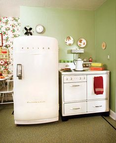 a white refrigerator freezer sitting inside of a kitchen