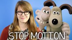 a woman with glasses standing next to a stuffed dog and the words stop motion on it