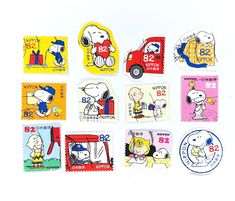 a group of stamps with cartoon dogs and people on them, all in different colors