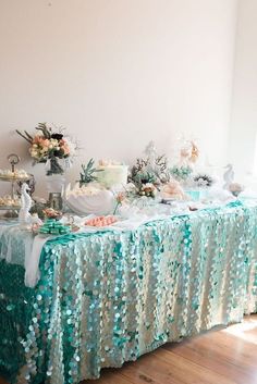 the table is covered with blue and white decorations