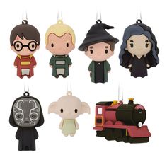 the harry potter ornament ornaments are hanging from strings and have characters on them