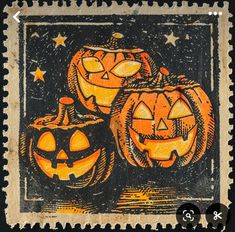 an old stamp with three carved pumpkins on it