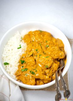 a white bowl filled with rice and curry