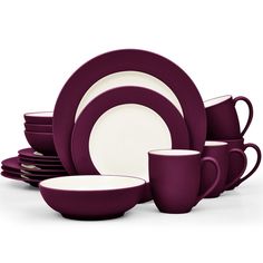 purple and white dinnerware set with matching mugs, saucers, and plates