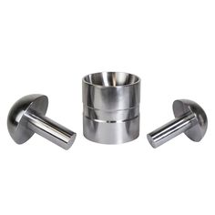 stainless steel cup holder with two metal cups on each side and one is holding an empty cup