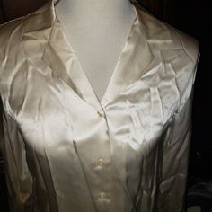 100% Silk Blouse Size Medium Kasper Long Sleeve Blouse Tags Attached With Extra Button Color Is Cream Pet Free Smoke Free Home ***Apologize That Its Wrinkled*** Folded In Storage Silk V-neck Top With Button Closure, Silk Collared Top For Daywear, Silk Blouse With Spread Collar For Daywear, Silk Tops With Spread Collar For Daywear, Fitted Silk Shirt For Daywear, Checked Blouse, Paisley Shirt, Gold Blouse, Shirt Cuff