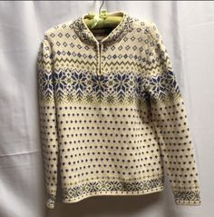 "Love Nordic style sweaters but can't handle the wool? Join the crowd, and go cotton. Cream with royal blue and olive snowflake design to scoop up now for the chilly months.No itching, just great looks for great times. Quarter zip pullover, tabbed collar. Size Medium: 18\" underarm to the  18\" hem width front  22\" Length shoulder to hem  Vintage, excellent condition. Note: The vintage sweaters in my shop are all in very good to excellent condition.  If I wouldn't wear it, I wouldn't sell it to you. I have a love of color and design, and am always on the lookout  for the fresh yarns, embellishments and quality of years gone by." Nordic Style Warm Sweater For Cold Weather, Long Sleeve Sweater With Fair Isle Pattern For Outdoor, Wool Long Sleeve Fair Isle Pattern Top, Nordic Knit Tops With Fair Isle Pattern, Winter Fair Isle Pattern Sweater For Outdoor, Cozy Fair Isle Pattern Winter Tops, Knit Tops For Cold Weather And Winter, Fair Isle Sweater For Cold Weather, Nordic Fair Isle Pattern Tops For Winter