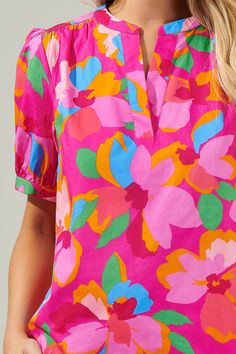 Daphne Floral Neli Split Neck Top – Sugarlips Pink Floral Print Blouse With Split Neck, Pink Split Neck Blouse With Floral Print, Pink Floral Print Split Neck Blouse, Tropical V-neck Top With Vibrant Print, Vibrant Multicolor Print V-neck Blouse, Pink Pants, White Pants, Cotton Style, Puff Sleeve