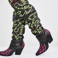 Atomic On The Run Bandit Cowgirl Boots Will Draw Em In So You Can Break Their Hearts. These Slouchy Knee High Cowboy Boots Have Neon Green Embroidered Details, Chunky Heels, Pointed Toes, And Contrast Pink Snakeskin Panels On The Top. Black Man Made Materials 3" Heel 22.5" Shaft Knee High Combat Boots, Snakeskin Cowboy Boots, Volatile Shoes, Sequin Boots, Metallic Boots, Black High Boots, Lace Up Leggings, Patent Boots, Snakeskin Boots