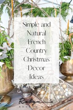 a table topped with christmas decorations and greenery next to a sign that reads, simple and natural french country christmas decor ideas