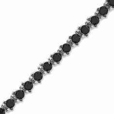 This new take on the traditional tennis bracelet is a great look for the modern sophisticate. Fashioned in sleek sterling silver, an array of glistening black spinels in three-prong settings are linked in perfect alignment, creating this bold and dramatic look. Buffed to a brilliant shine, this 7.5-inch bracelet secures with a lobster claw clasp. Classic Round Black Diamond Bracelet, Formal Tennis Bracelet With Black Diamonds, Elegant Bracelet With Black Diamonds, Elegant Black Diamond Round Bracelets, Formal Bracelets With Black Diamonds, Elegant Black Diamond Round Bracelet, Classic Tennis Bracelet With Black Diamonds For Formal Occasions, Black Diamond Round Bracelet, Classic Black Diamond Tennis Bracelet