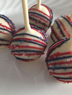 cake pops with red, white and blue sprinkles on them are ready to be eaten