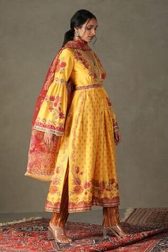 Yellow anarkali with all-over floral prints, embroidered yoke and sleeves. Comes with contrast floral embroidered dupatta and striped pant. - Aza Fashions Eid Sharara With Dupatta Ankle-length, Eid Ankle-length Sharara With Dupatta, Ankle-length Sharara With Zari Work For Diwali, Bollywood Ankle-length Sharara With Cutdana, Bollywood Style Ankle-length Cutdana Sharara, Festive Ankle-length Palazzo Set With Dupatta, Ankle-length Sharara With Cutdana For Navratri, Ankle-length Cutdana Sharara For Navratri, Ankle-length Palazzo Set For Wedding And Navratri