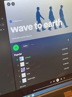 a computer screen with the words wave to earth on it and people walking in different directions