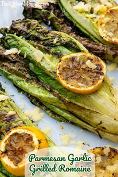 grilled artichokes with lemon and parmesan garlic are on a white plate