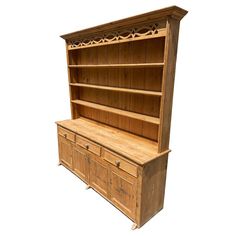 an old wooden bookcase with drawers and cupboards