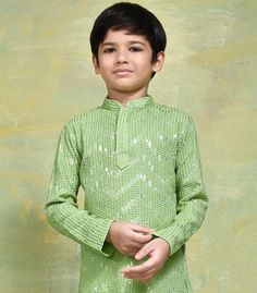 This exquisite Kids Kurta Set is specially crafted for Birthdays , Indian weddings and festivals. The set includes a beautifully self-embroidered Dopion art silk top, paired with your choice of a ready-made Dhoti, Chudidar or Patiyala bottom. Attributes 1. Top - Chmki Work On Rayon 2. Bottom - Ready Made Chudidar/ Doti/Patiyala 3. Colors -  Green / Yellow Note For Perfect Fitting * Pls Check the kid's Body Chest Exact Measurement With Out Adding Any Space or Gap From Your Side * Kindly Mention the Boy's body chest and Your Height While Placing The Order 🔺Disclaimer: Product Colour May Slightly Vary Due to Photographic Lighting Sources or Your Monitor Settings Thank You for Visiting Festive Party Kurta With Cutdana, Festive Cutdana Kurta For Party, Festive Pista Green Set With Zari Work, Long Sleeve Party Sets For Transitional Season, Long Sleeve Pista Green Sets For Navratri, Festive Long Sleeve Pista Green Kurta, Festive Pista Green Long Sleeve Kurta, Pista Green Long Sleeve Sets For Navratri, Pista Green Sets With Self Design For Diwali