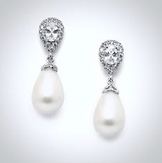 A classy and delicate pair of earrings perfect for the romantic bride, featuring pearls in an iridescent white color and clear cubic zirconia. Electroplated with noble metals (rhodium, 14K rose gold, and 14K yellow gold) for a flawless finish which perfectly enhances the intricate detailing and conveys a modern take on old elegance, these exquisite earrings will add a touch of sophistication to any wedding gown or formal ensemble. Length: 1.25" (approx. 3.2cm); Width: 0.4" (approx. 1cm); Weight: Formal Pearl Embellished Drop Chandelier Earrings, Formal Pearl Embellished Chandelier Drop Earrings, Elegant Pearl White Chandelier Earrings With Pearl Drop, Elegant Pearl White Chandelier Earrings, Elegant Diamond White Pearl Bridal Earrings, Pearl Bridal Earrings With Diamond Accents For Wedding, Elegant Pearl Earrings With Cubic Zirconia, Bridal Pearl Earrings With Diamond Accents For Wedding, Classic White Teardrop Earrings With Diamond Accents