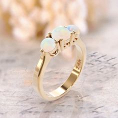 14k 3 opal ring art deco opal engagement ring gold white opal ring Rose Gold Ring October Birthstone opal jewelry minimalist promise ring gift ► FEATURES; Gemstones: natural 3 opal : 5mm ,2x3mm Material options: 14k rose gold, 14k yellow gold, 14k white gold Size: all ring sizes are available How to Order: Please select your preferred size and material from the menu while adding to cart. We pride ourselves to offer customization of almost any shape and style of a ring. If you desire a specific m Gold Round Cut Opal Ring, Fine Jewelry Opal Ring With Round Stone For Gift, Fine Jewelry Opal Ring Gift, Classic Opal Moonstone Anniversary Ring, Fine Jewelry Opal Ring For Gifts, Classic Moonstone Opal Ring For Anniversary, Elegant Gold Opal Ring, Gold Opal Jewelry With Round Cut, Classic Round Cut Opal Birthstone Ring