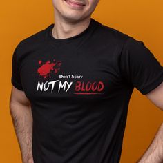 A Halloween-themed T-Shirt with a 'Don't scary, Not my blood' design with red blood. Perfect for adding a spooky touch to your casual outfits, ideal for Halloween enthusiasts and horror fans. Great for wearing to Halloween parties, haunted houses, or just for a fun everyday look. Product features - Made with 100% lightweight cotton for breathability and layering - Retail fit for casual and semi-formal settings - Manufactured in a humane, sustainable way by Bella+Canvas - Tear-away label for mini Horror Costume, Red Blood, Haunted Houses, Halloween Theme, Halloween Parties, Fete Halloween, Halloween Themes, Festival Season, Everyday Look