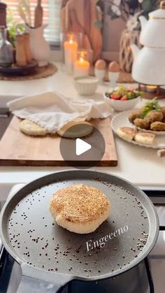 a video demonstrating how to make an english muffin on the stove top with a frying pan