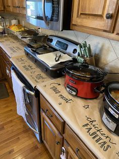 the kitchen counter is covered with various pots and pans, including an electric pressure cooker