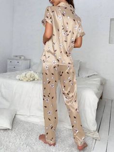 Experience the epitome of comfort with our Floral Print Contrast Piping Satin Pajama Set, featuring a delightful floral print and contrasting piping. This two-piece ensemble includes a short sleeve button-front top with convenient pockets and a pajama. Crafted from non-stretch fabric, it offers both elegance and relaxation for your leisure time. Features: Style: Fantasy-Elegant Pattern Type: Floral Type: Pant Sets Neckline: Lapel Details: Pocket, Contrast Binding, Button Front Sleeve Length: Sho Beige Home Sets For Spring, Casual Beige Floral Print Sets, Floral Print Short Sleeve Sleep Set, Floral Print Sleep Sets With Short Sleeve, Short Sleeve Floral Print Sleep Sets, Short Sleeve Floral Sleep Set, Floral Print Short Sleeve Sleepwear Set, Floral Print Short Sleeve Sleepwear For Comfort, Printed Short Sleeve Sets For Home