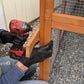 a man laying on the ground in front of a cage