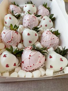 chocolate covered strawberries in a box with white marshmallows