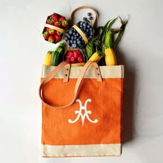 Photo displays Hestan's vibrant citra orange market tote on a marble counter, overflowing with market fresh berries and zucchini Fresh Ingredients, Market Tote, House Design, Marketing, Orange, Design