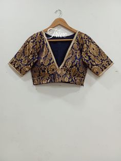 This Made to Order/Made to Measurement/Custom Made Indian Ethnic Blouse. - Fabric - Banarasi Silk - Color - Black - Princess Cut - Rich Lined - Sleeveless - Extra margin and extra stitches included in the blouse - It can be customize in any color, design or size  PLEASE NOTE: BUYERS ARE RESPONSIBLE FOR ANY CUSTOMS AND IMPORT TAXES THAT MAY APPLY. This is a made to order product. If you opt for 'Made To Measurement Option', we will provide a measurement template and you can share the measurements Traditional V-neck Choli With Resham Embroidery, Traditional V-neck Choli With Cutdana, Traditional V-neck Cutdana Choli, Anarkali V-neck Choli For Festive Occasions, Anarkali Lehenga With V-neck Fitted Style, Bollywood Style V-neck Choli With Zari Work, Anarkali Choli With Zari Work, Traditional V-neck Lehenga For Festive Occasions, Diwali Anarkali V-neck Choli