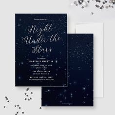 the night under the stars wedding card is shown on top of a table with silver stars