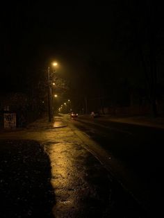 an empty street at night in the dark