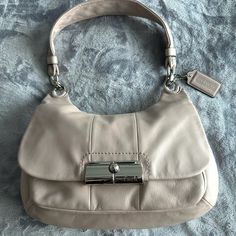 Cream Coach Shoulder Bag. Basically Brand New. Silk Mauve Inside Lining Of The Bag. Very Soft Leather Bag. Classic Satchel With Silver-tone Hardware For Errands, Classic Beige Bag With Silver-tone Hardware, Classic Pouch Shoulder Bag, Beige Bags With Silver-tone Hardware For Everyday Use, Beige Satchel Hobo Bag With Silver-tone Hardware, Coach Beige Shoulder Bag With Silver-tone Hardware, Classic Shoulder Bag With Branded Hardware For Errands, Everyday Shoulder Bag With Branded Hardware, Elegant Beige Hobo Bag With Silver-tone Hardware