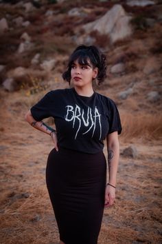 Bruja: Magical Mujer. Mujer Con Poder🖤 100% Cotton Style: T shirt Fit: Unisex fit Care: Wash cold inside out. Tumble dry Low heat. Do not Iron on direct logo. Fitted T-shirt For Streetwear, Alternative Short Sleeve Tops With Text Print, Alternative Style Short Sleeve Tops With Text Print, Alternative Style Tops With Text Print And Short Sleeves, Pre-shrunk Stretch Tops For Streetwear, Stretch Pre-shrunk Tops For Streetwear, Stretch Grunge T-shirt For Streetwear, Grunge Stretch T-shirt For Streetwear, Alternative Cotton Tops With Text Print