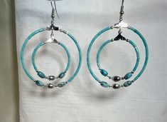 Turquoise Double Hoop earring handmade by me Gwen a member of the Navajo tribe I used semi precious turquoise with plated silver accents and surgical steel earring hooks. Handmade Southwestern Turquoise Hoop Earrings, Turquoise Southwestern Nickel-free Hoop Earrings, Southwestern Turquoise Nickel-free Hoop Earrings, Southwestern Turquoise Hoop Earrings Nickel Free, Artisan Nickel-free Turquoise Hoop Earrings, Turquoise Nickel-free Small Hoop Beaded Earrings, Southwestern Turquoise Hoop Earrings For Gift, Southwestern Turquoise Hoop Earrings As Gift, Double Hoop Earring